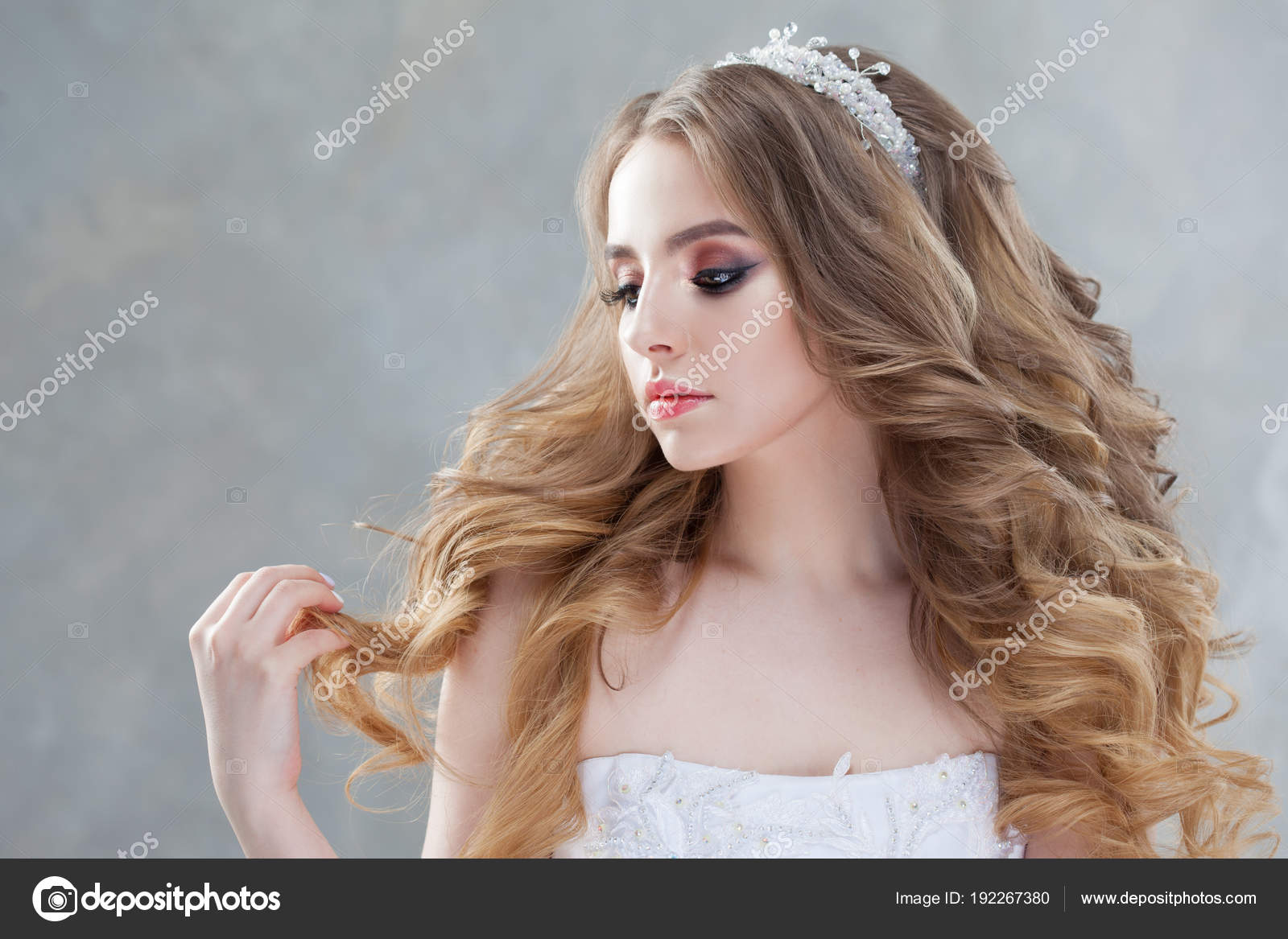 Young beautiful bride with luxurious curls. Wedding hairstyle with tiara. Stock Photo by ©KrisCole 192267380 Young beautiful bride with luxurious curls. Wedding hairstyle with tiara. Stock Photo by ©KrisCole 192267380
