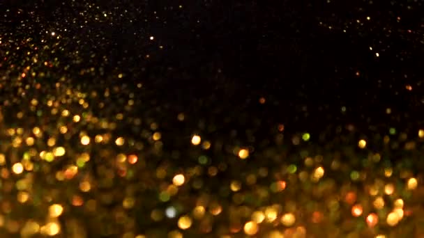 Gold glitter magic background. Defocused light and free focused place for your design. — Stockvideo