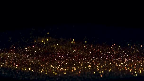 Bouncing gold particles on a black background, the concept of rhythm or music — 비디오