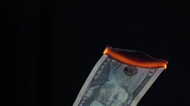 Burning dollar, global financial crisis and inflation, concept