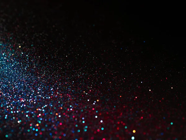 Veelkleurige glanzende glitter in focus en onscherp, abstracte glanzende achtergrond — Stockfoto