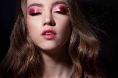 Fashion portrait of a young beautiful woman with long blonde hair.