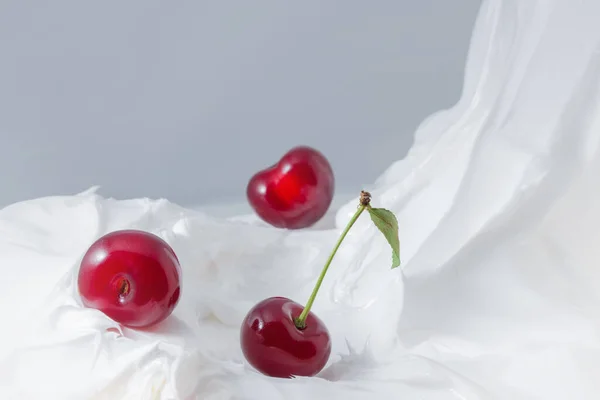 Sweet cherry in yogurt. Close-up milk or cheese dessert with cherries.