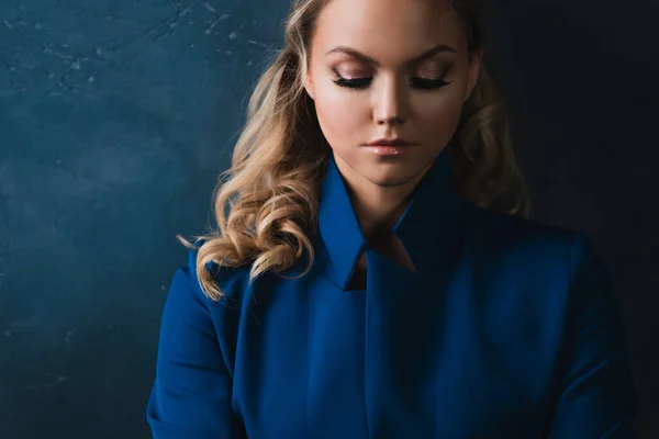 Business portrait of a stylish young blonde in a blue jacket — Stock Photo, Image