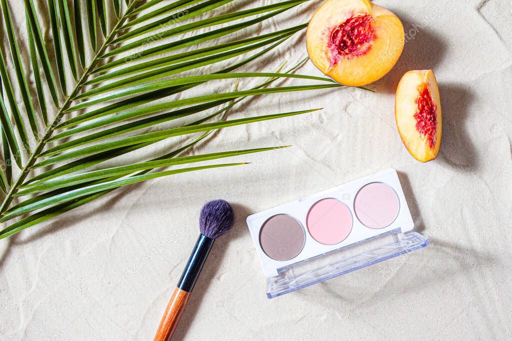 Vacation. A sculpting palette and brush lie on the beach sand, surrounded by vibrant fruits, corals, and palm leaves.