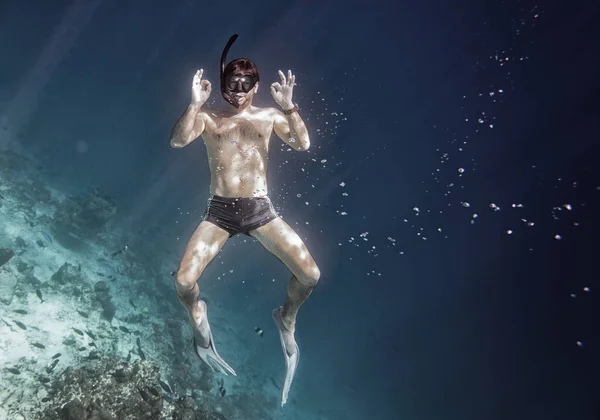 Snorkeling man is posing under the water — Stock Photo, Image