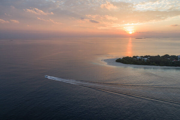 Aerial view on Maldivian island Ukulhas during the sunset
