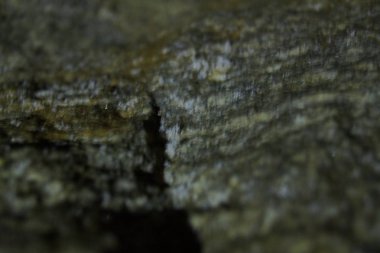 Geceleyin arka plan için bir fenerin ışığında taşın dokusu