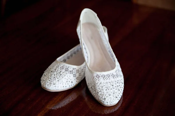 Summer ballet flats of white color against a dark background — Stock Photo, Image