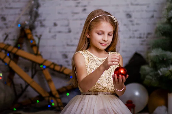 Beautiful girl with toy christmas ball — Stock Photo, Image