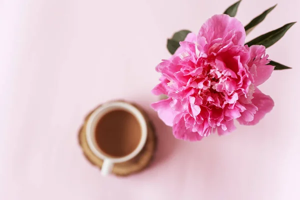 Banner of Bouquet Peony flowers on pink backgroun and cup of coffee. Copy space. flat lay. Good morning