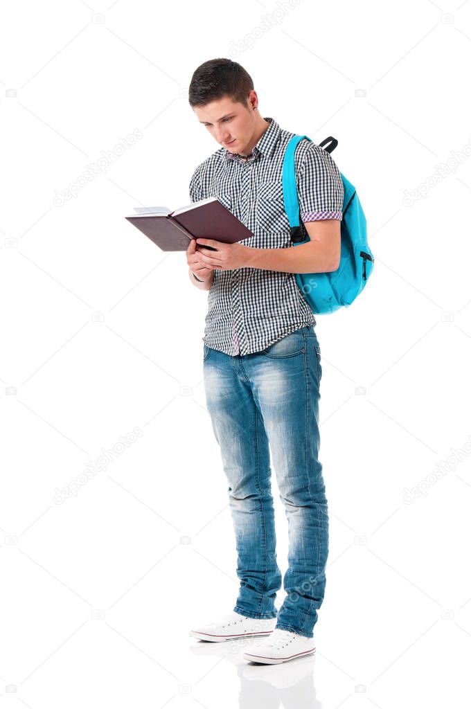 Teen boy with backpack and notepad