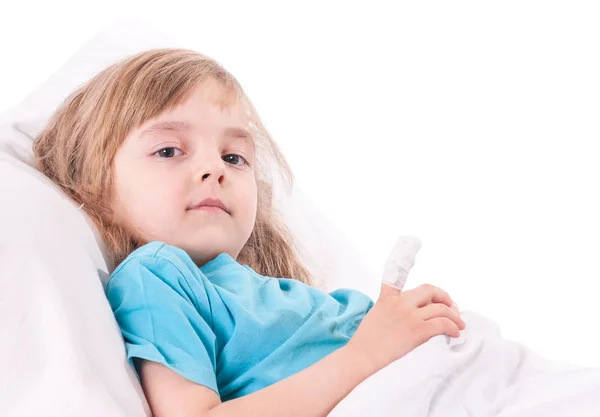 Sick little girl in bed Stock Image