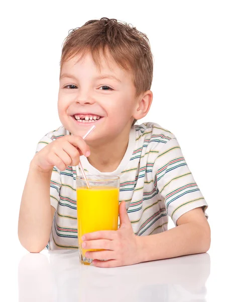 Little boy drinking orange juice — Stock Photo, Image