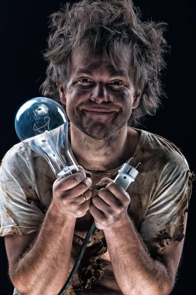 Burnt man with light bulb — Stock Photo, Image