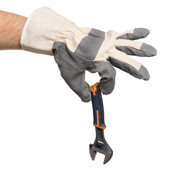 Χέρι με γάντι και ρυθμιζόμενο κλειδί — Φωτογραφία Αρχείου