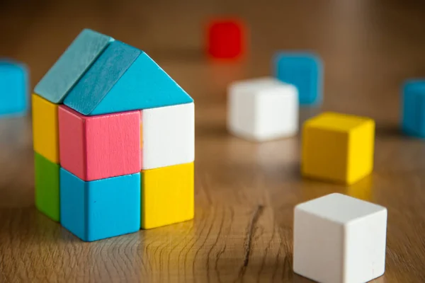 color wooden block form of house shape