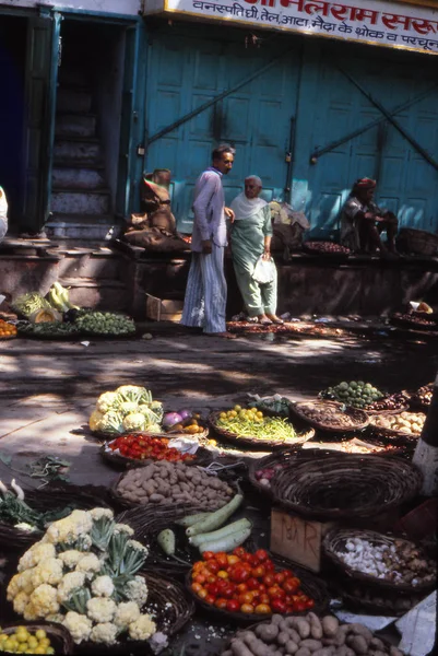 Men meet in the vegetable market