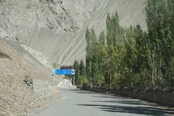Narrow twisting road along Indus river