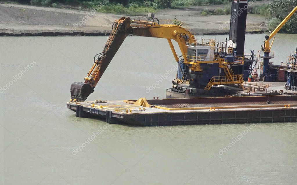 Dredge shovel boat fills barge — Stock Photo © cascoly 188049410