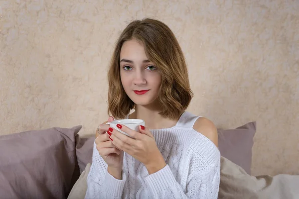 Girl with a cup of coffee — Stock Photo, Image