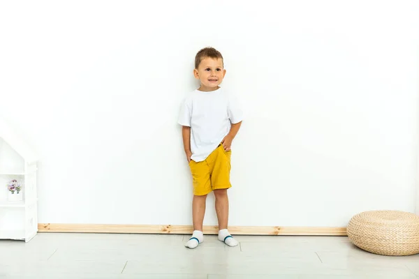 Cute Little Boy Yellow Shorts White Shirt Hands Pockets White — Stock Photo, Image