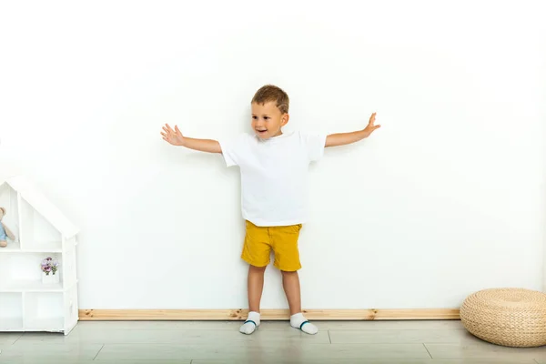 Cute Little Boy Hands Side Yellow Shorts White Shirt White — Stock Photo, Image