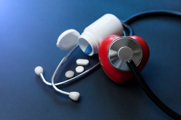 Red Toy Heart Jar Pills Stethoscope Dark Blue Healthcare Medical — Stock Photo, Image