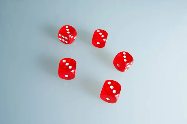 Red dice on the glass. Five dice with the value of \