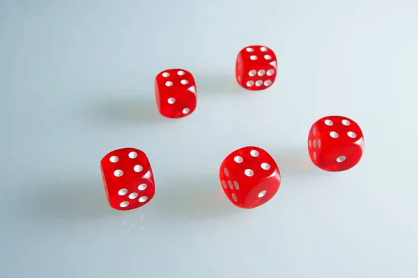 Red dice on the glass. Five dice with the value of \