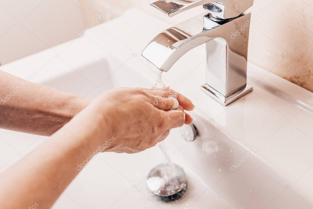 Personal hygiene - washing hands with soap - solid antibacterial soap and warm water