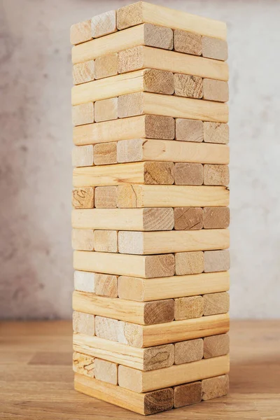 Tower of wooden blocks and bars - board game - a game of dexterity, logic and coordination