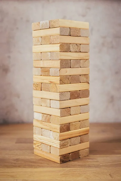 Tower of wooden blocks and bars - board game - a game of dexterity, logic and coordination