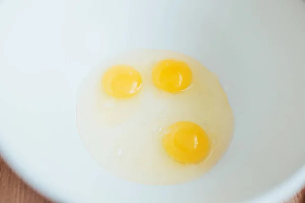 Three Chicken Eggs Bright Yolk White Plastic Bowl Kitchen Utensil — Stock Photo, Image
