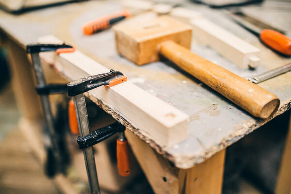 Carpentry workshop - workplace on the workbench - tools and materials
