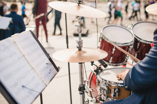 Drummer's workplace - drum kit and stand for notes selective focus