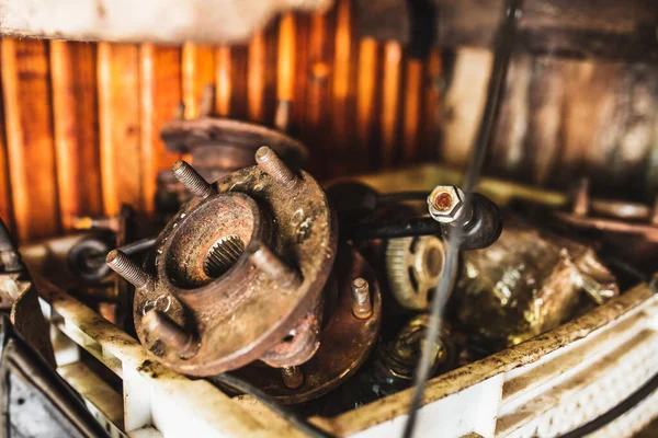 Old rusty wheel hubs in a car workshop - auto repair shop