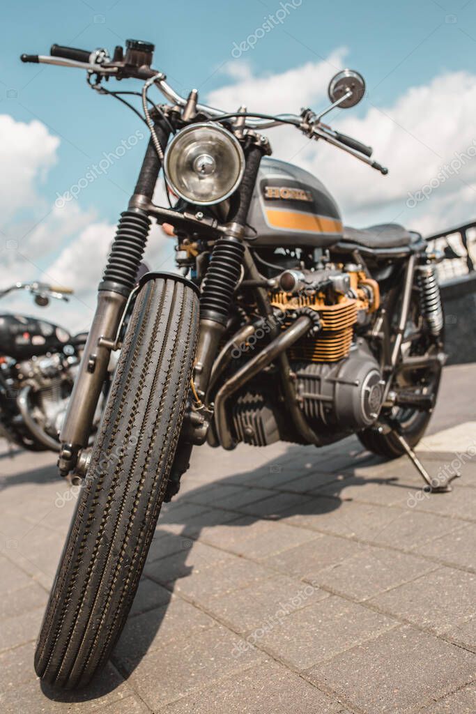 Minsk, Belarus - September 13, 2019: A vintage Honda motorcycle against a blue sky with clouds ready for a long trip
