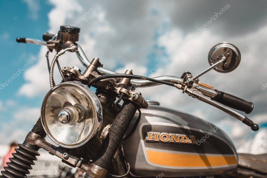 Minsk, Belarus - September 13, 2019: A vintage Honda motorcycle against a blue sky with clouds ready for a long trip