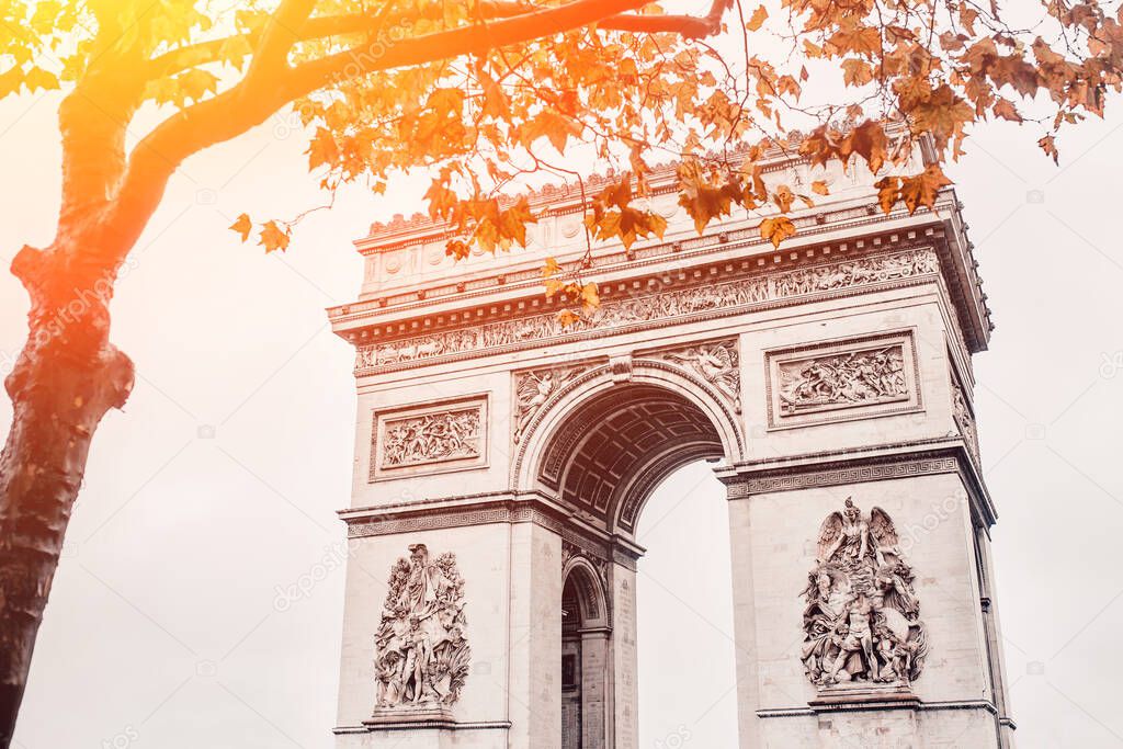 Arc de Triomphe in Paris on a cloudy fall day - French charm and tourist attractions