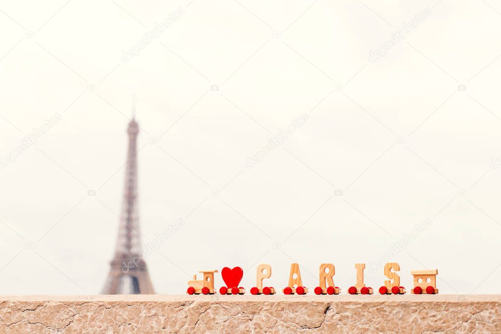Back with the symbol of France and Paris - the Eiffel Tower - in the foreground the inscription I love Paris - copy space
