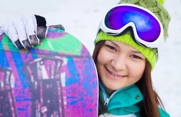 Girl snowboarder in glasses — Stock fotografie