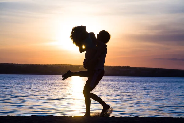 Lovers at sunset — Stock Photo, Image