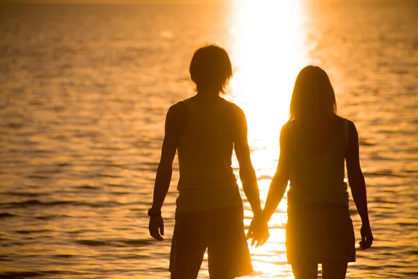 Lovers at sunset — Stock Photo, Image