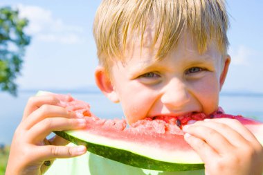 boy eating watermelon