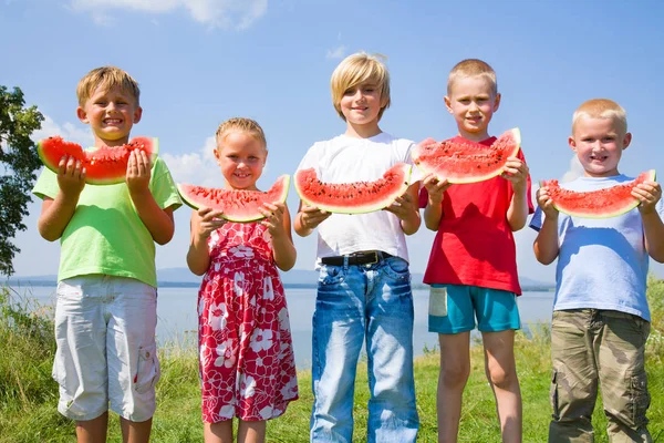 Children with red watermelon — Stock Photo, Image