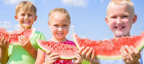 Children with red watermelon — Stock Photo, Image