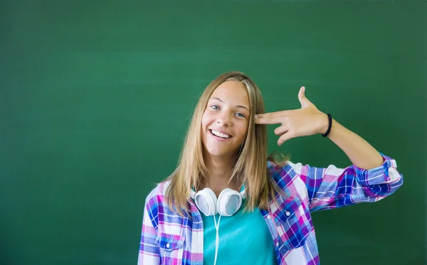 Girl student  at the blackboard — Stock Photo, Image