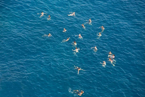 People swimming in sea — Stock Photo, Image
