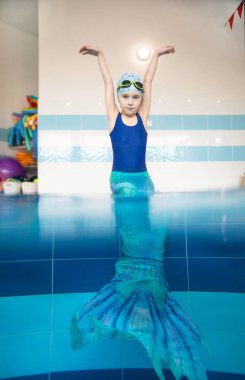 little girl in a mermaid costume clipart